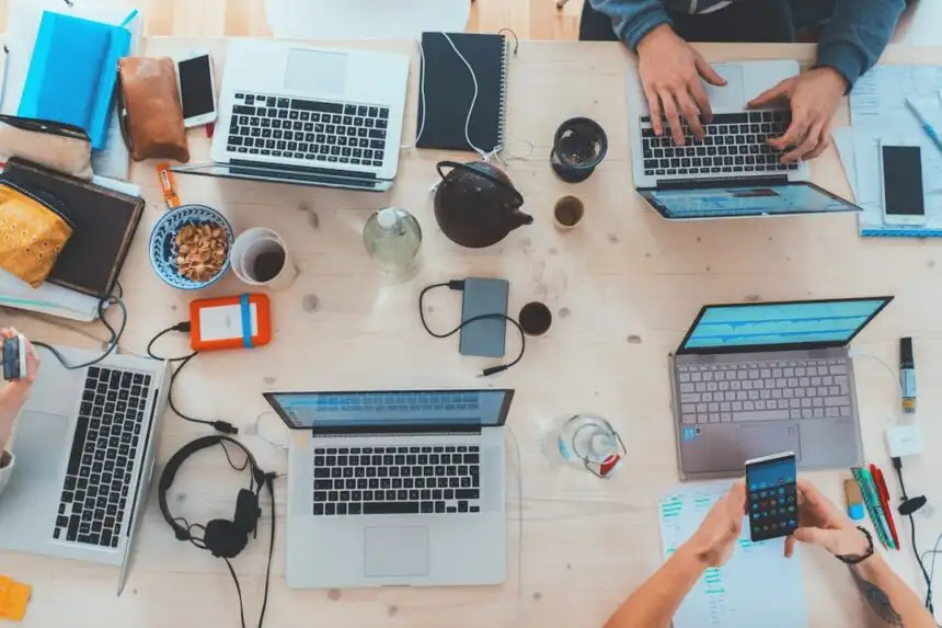 Professionals working collaboratively in modern office representing career skills for AI era